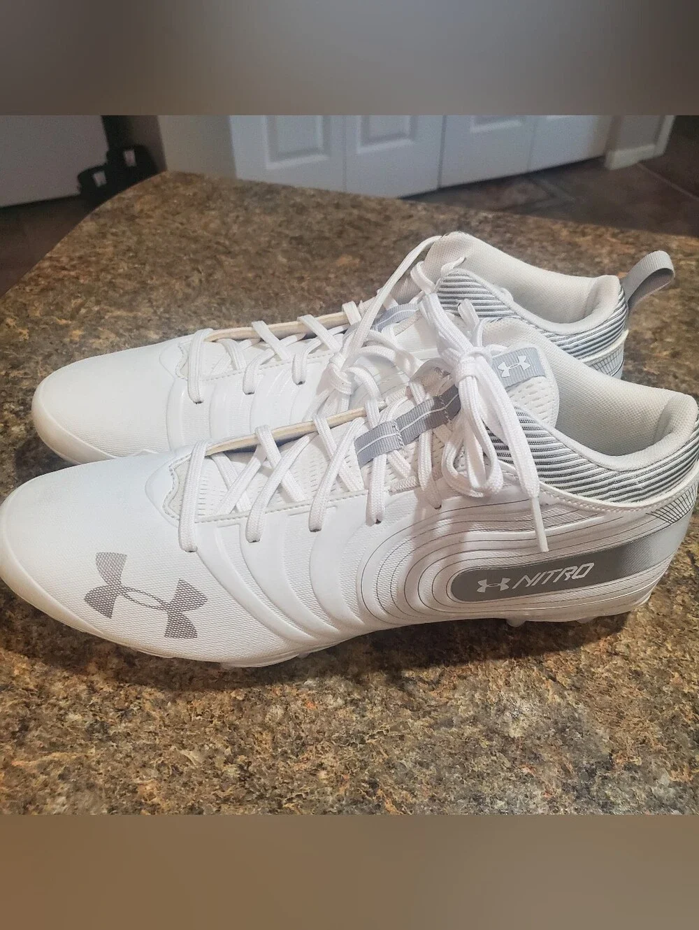 UNDER ARMOUR NWOT SZ 14. NITRO MID MC FOOTBALL CLEATS. WHITE SILVER